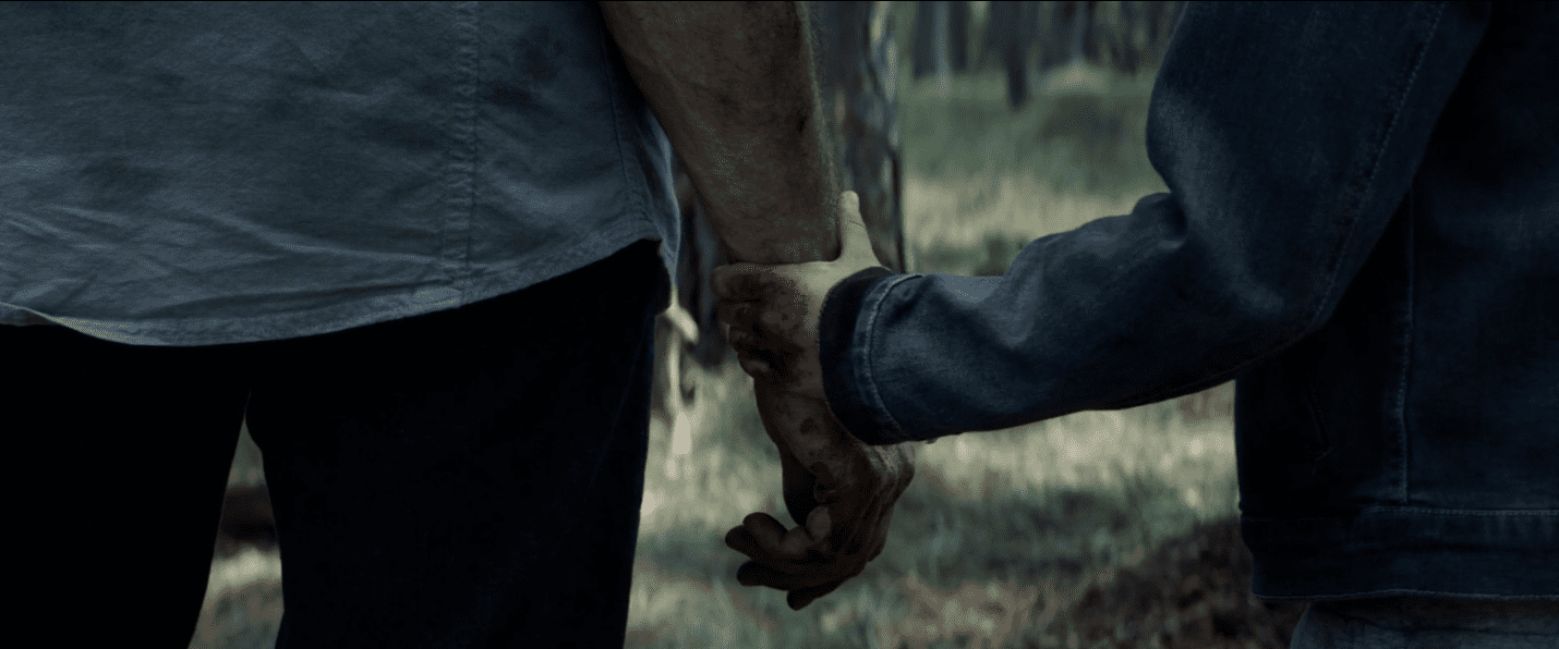 Logan et X-23 qui se tiennent la main