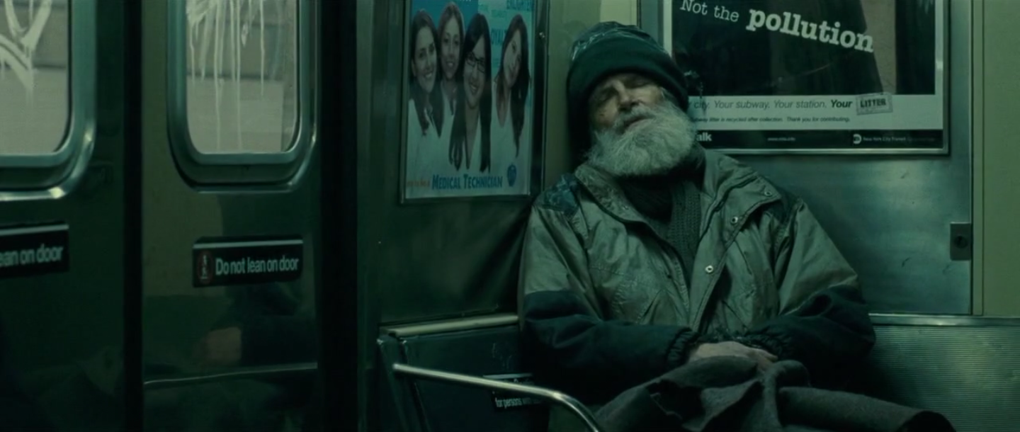 contre-champ sur un sans-abris assis en face